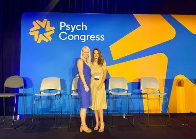 Two female doctors at a conference.